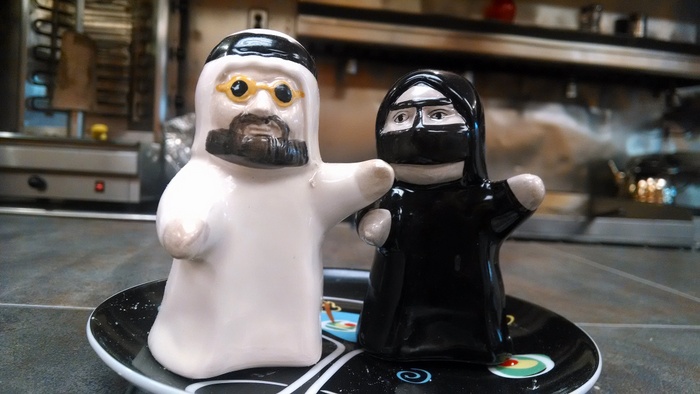 Little Muslim themed salt & pepper shakers with the man in his thode and the woman in her burqa